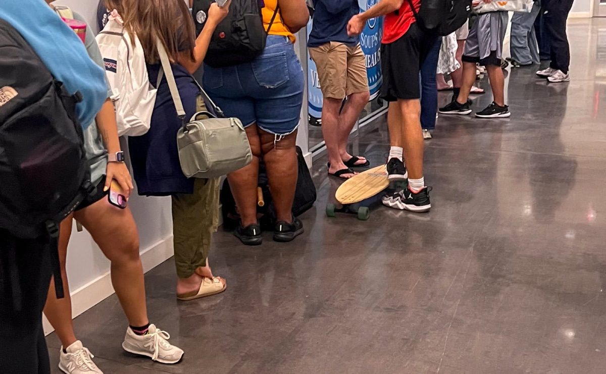 Line of students waiting outside Lend-A-Wing food pantry