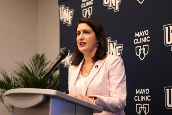 Woman standing at podium.