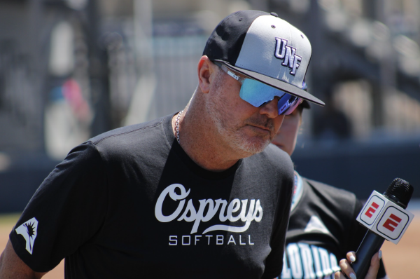 UNF head softaball coach being interviewed after a game.